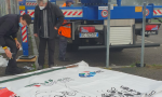 Sciopero Enel, i sindacati appendono a una gru uno striscione di protesta lungo 40 metri